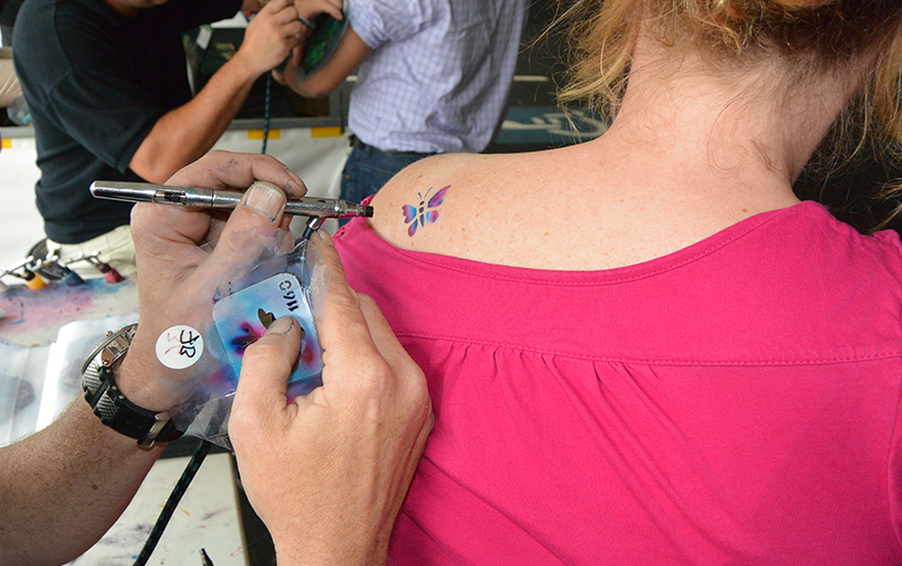 Our airbrush tattoo artists comes complete with a diamond plated push cart 